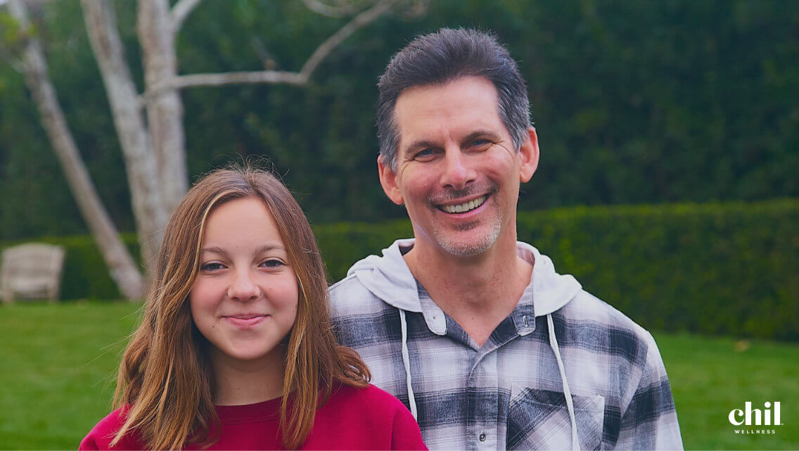 Kevin and Apen standing together and smiling